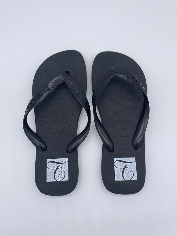 TransPerfect Flip Flops